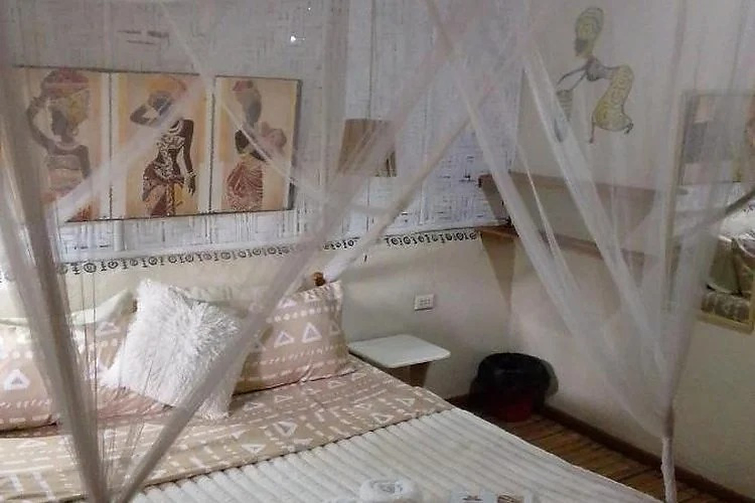 A restful guest room with woven textures and local artwork