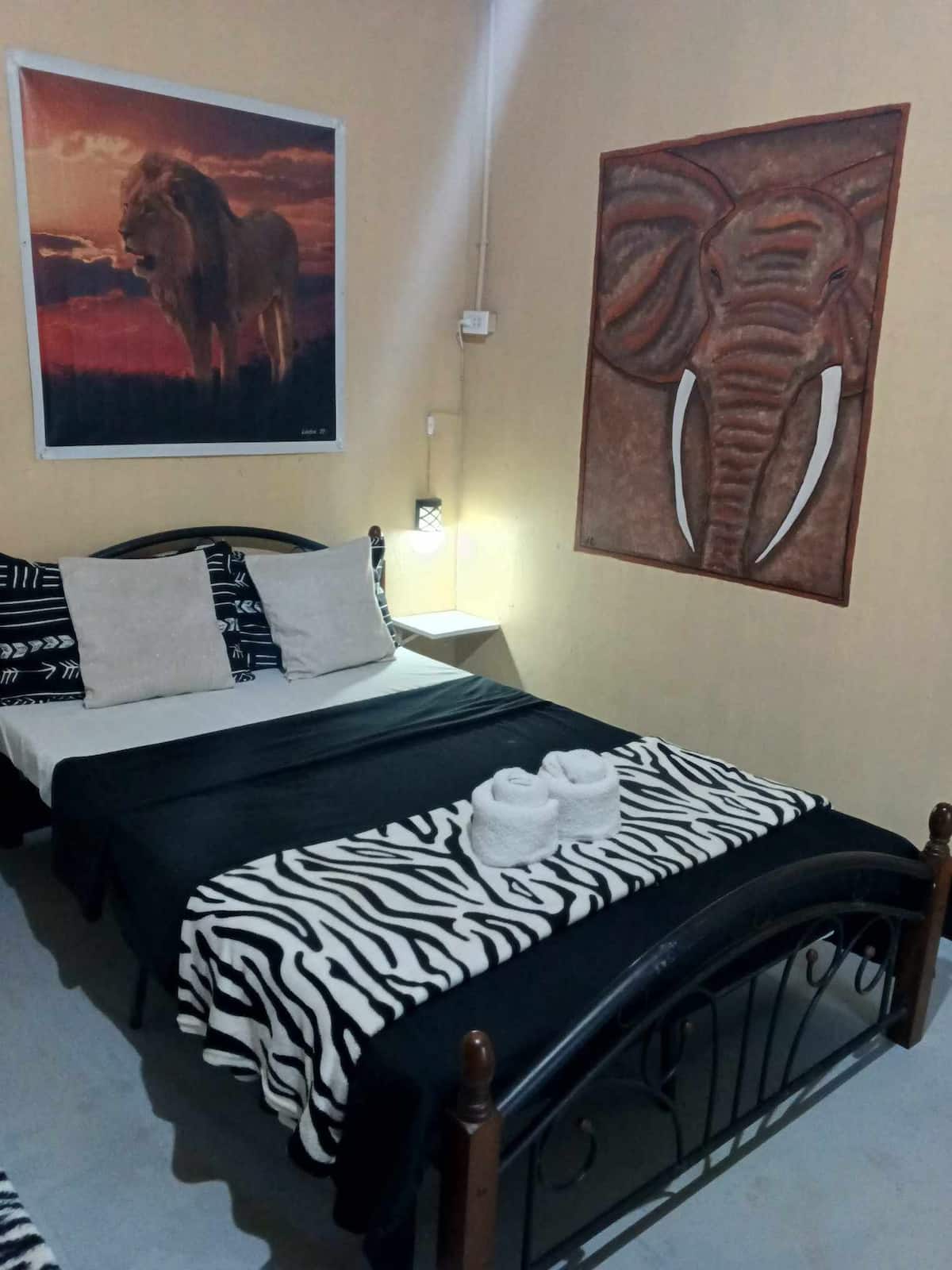 Economy Double Room with double bed and artwork